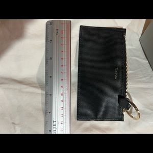 100% guaranteed authentic Tom Ford coin purse. All black with ridges, never used
